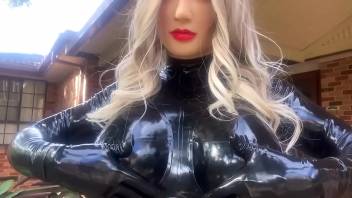 Living Rubber Doll Playing with Big Latex Boobs